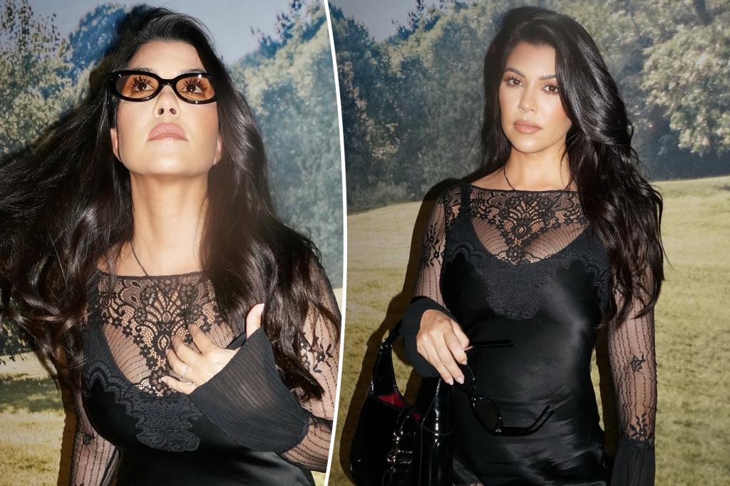 Kourtney Kardashians rocks sheer lace mini costume
